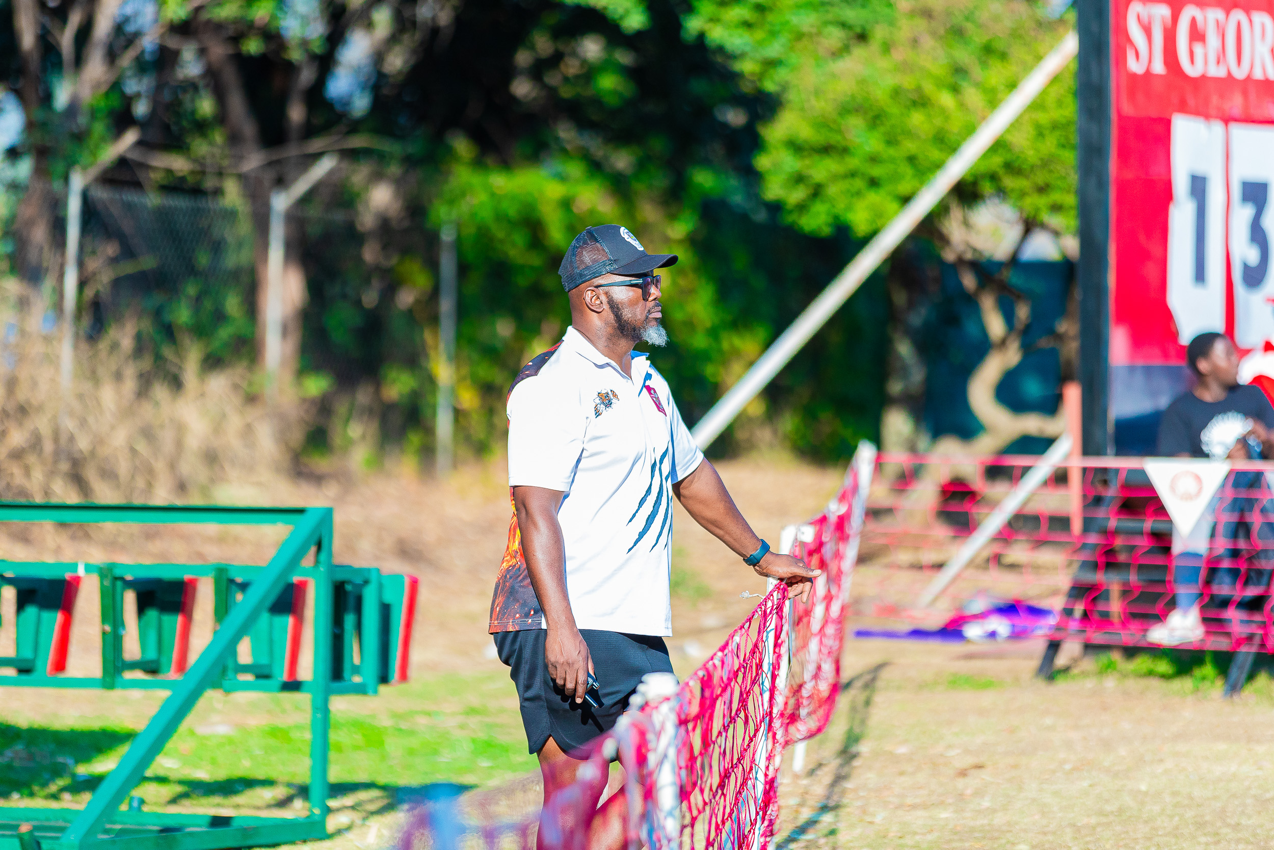 Prince Edward Tigers Coach watching the game play from a bird's eye view